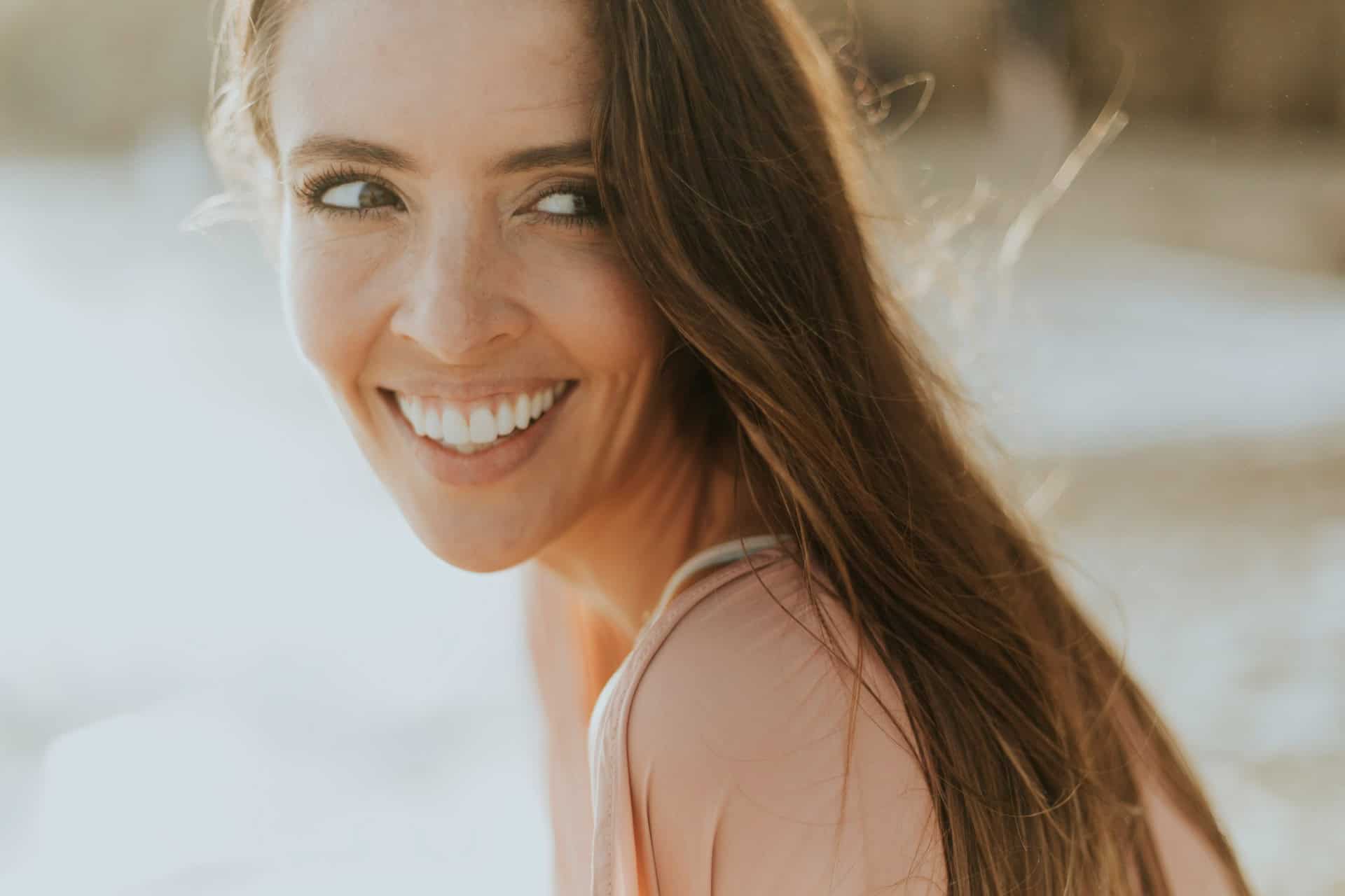 Kaitlin McMillan smiling portrait outdoors.